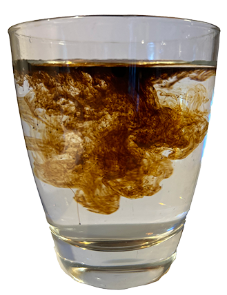 Fulvic Humic Crystals diluting in a glass of filtered water